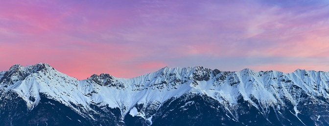 A panoramic view of Nordkette at purple sunset, Austria, Tirol, Innsbruck