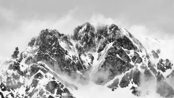 Photo of Grayscale view of snow-covered Nordkette, Tirol, Innsbruck, Austria