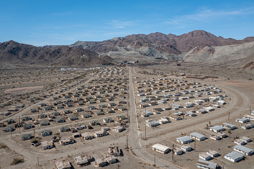 Eagle Mountain, United States – March 18, 2022: The abandoned homes of Eagle Mountain, a former mining town, remain empty  in the Southern California desert.