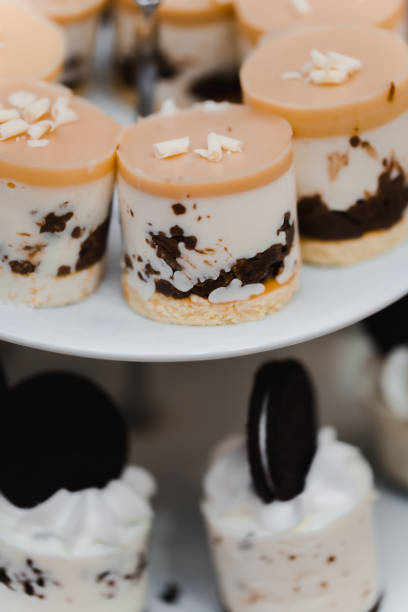 istock Wedding table with sweets, cake, pastries, muffins, sugar treats. 1454962635