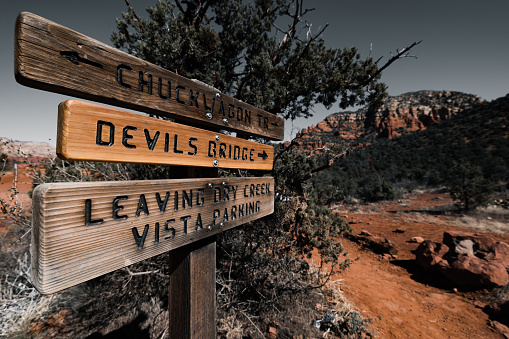 Sedona, United States – February 25, 2022: A closeup shot of road direction signs near the Devils Bridge Trail in Arizona, United States