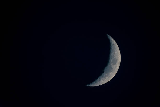 new moon in a black sky in detail