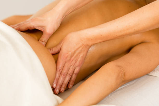 istock Therapeutic massage session with essential oils on a female's back 1454963774