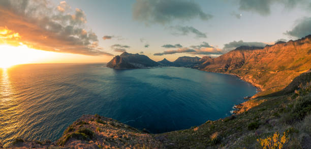 Aerial view of the sunset over the Chapmans Peak Drive, Cape Town, South Africa An aerial view of the sunset over the Chapmans Peak Drive, Cape Town, South Africa chapmans peak drive stock pictures, royalty-free photos & images