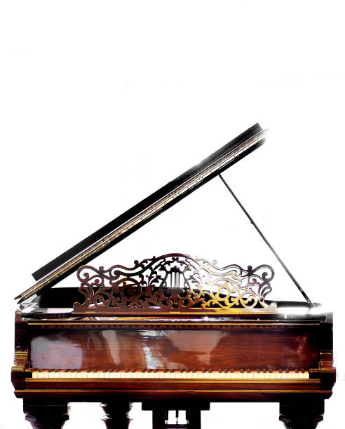 istock Vertical shot of a brown piano isolated on a white background 1454969531