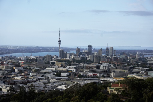 Auckland, New Zealand – December 12, 2019: A scenic view of the cityscape of Auckland in the North Island, New Zealand in blue sky background