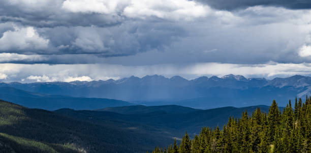 istock Scenic view of a mountainous landscape in cloudy sky background 1454974464