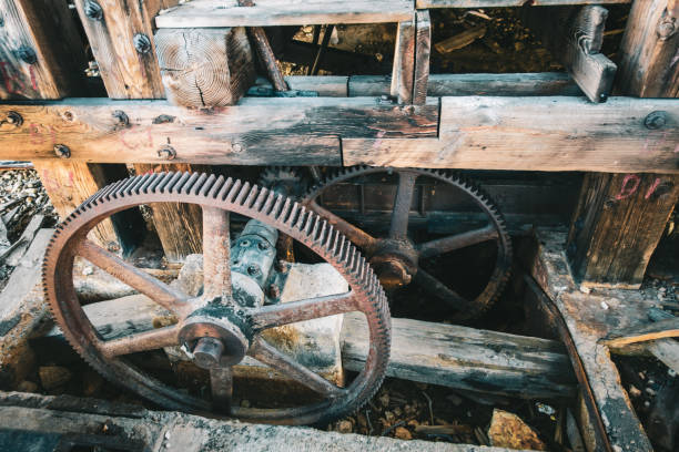 Old wooden structure with rusty metal wheels in Silverton, Colorado