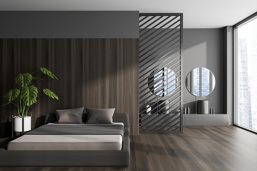Front view on dark studio interior with bed, grey wall, panoramic window with Singapore view, double sink, two round mirror, partition, wooden floor. Concept of space for chill. 3d rendering