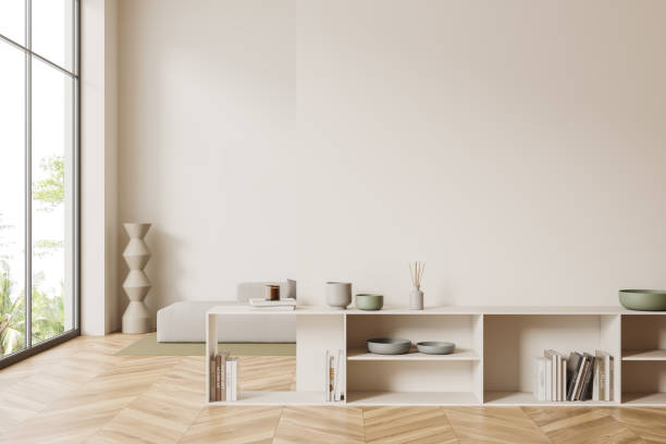 istock Light chill interior with shelf and decor, couch near window. Mockup wall 1454976170