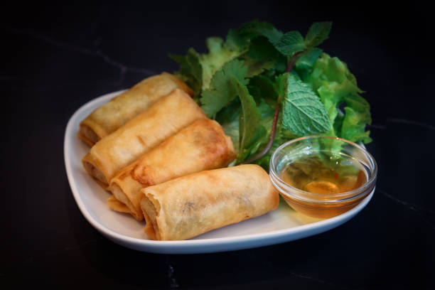 istock A crispy deep fried spring rolls wrapped stuffed with rice vermicelli and assorted veggies in a plate 1454976454