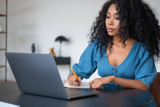 istock African young woman take note looking at laptop screen, e-learning 1454976650