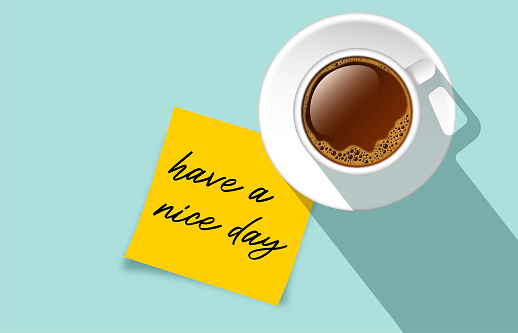 Cup of coffee top view on turquoise background and Have a nice day! Text on yellow paper