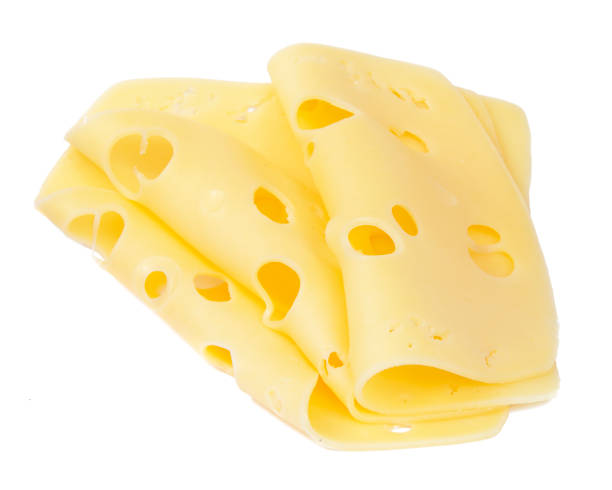 istock Yellow cheese slices isolated on a white background 1454977789