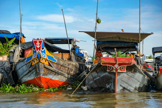 Can Tho, Vietnam - January 4, 2023: Fruit and vegetable vendors at the Cai Rang floating market in the Mekong River Delta in Can Tho, Vietnam.