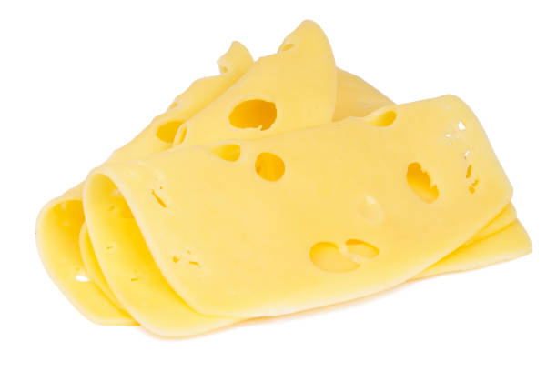 istock Yellow cheese slices isolated on a white background 1454978778