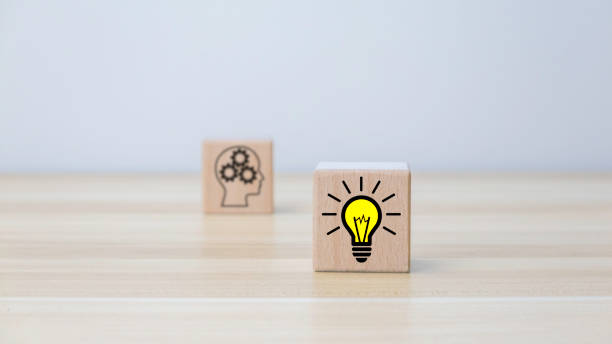 istock creative idea concept. hand man flip wooden block cube form human idea mark symbol to right light bulb symbol. vintage style 1454981473