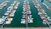 aerial view Yacht Marina in Yacht Club  Aerial luxury boats and yachts in achor park, Luxury Many line of row Yachts at  achor park or marina ocean