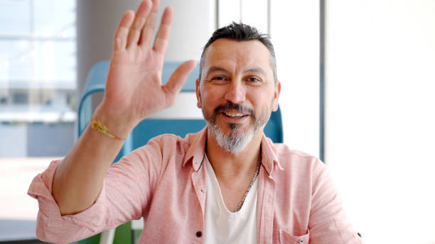 istock POV: Mature man video conferencing 1454984223