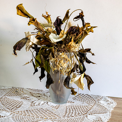 photo with flowers in a vase, a composition of many different colored flowers from dry, dried flowers, decorative dry plants