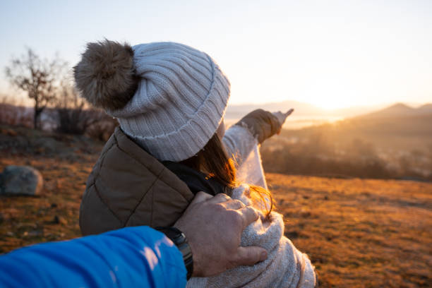 istock POV, couple enjoying the sunrise. 1454988066