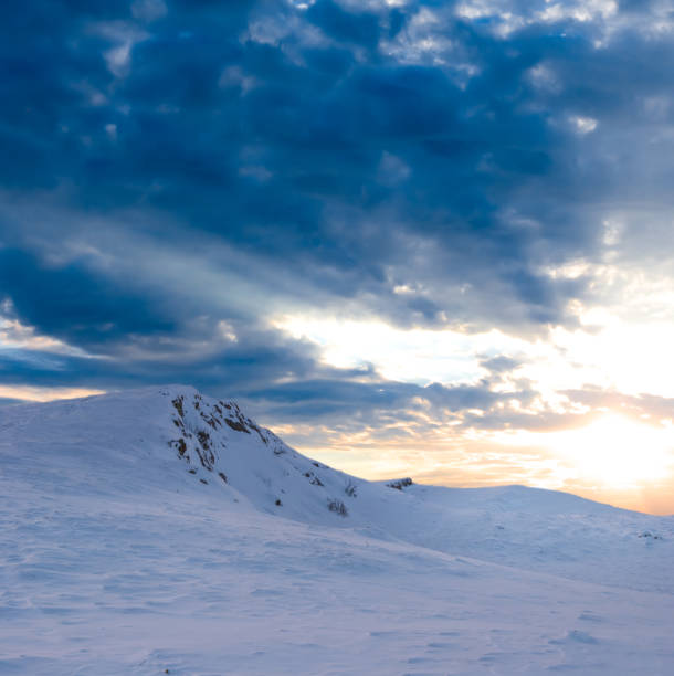 istock mountain in snow at the sunset 1454988169