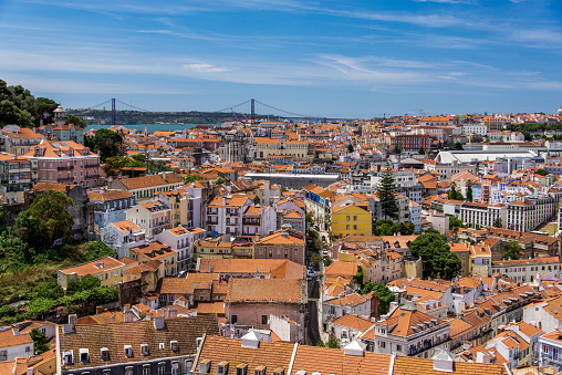 High angle view over Lisbon with the April 25th bridge over the Tagus river in the background., Portugal.