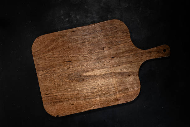 istock Wooden board on dark background 1454990984