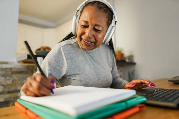 istock Senior woman working with laptop computer from home - Elderly lifestyle and technology concept - Focus on face 1454991212