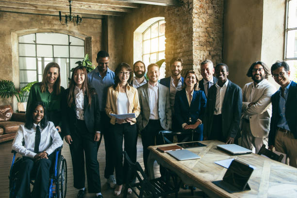 istock Multiracial business people working inside office - Focus on center man on background 1454991876