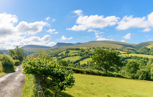 The Brecon Beacons National Park, Wales - June 20, 2022: The Brecon Beacons National Park (Welsh: Parc Cenedlaethol Bannau Brycheiniog) is one of three national parks in Wales, and is centred on the Brecon Beacons range of hills in southern Wales. It includes the Black Mountain (Welsh: Y Mynydd Du) in the west, Fforest Fawr (translates as 'great forest') and the Brecon Beacons in the centre and the Black Mountains (Welsh: Y Mynydd Du or Mynyddoedd Duon) in the east.