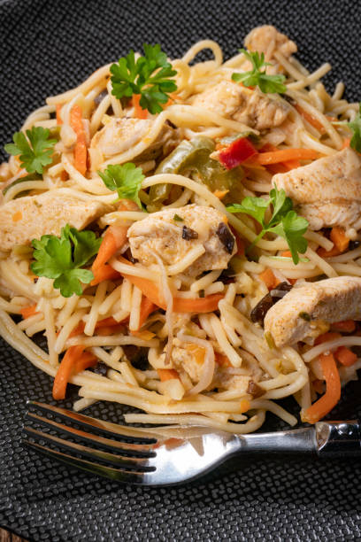 istock Fried noodles with chicken and vegetables. 1454992194