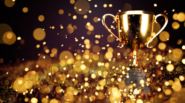 istock 3D illustration. trophy over wooden table and dark background bokeh. 1454992296