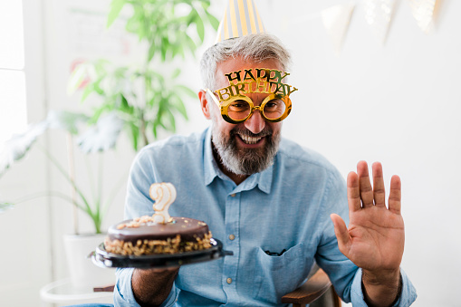 Senior man celebrating birthday at home