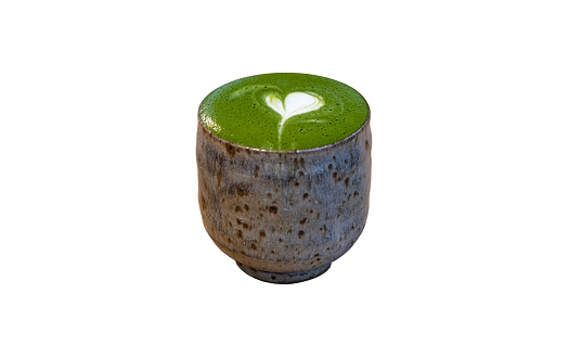 Matcha latte art in a Japanese-style glass isolated on white background with clipping path