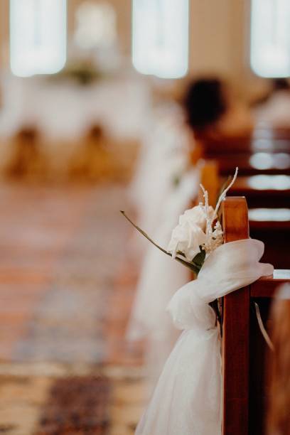 istock Closeup of chairs decorated for a wedding ceremony 1454997200