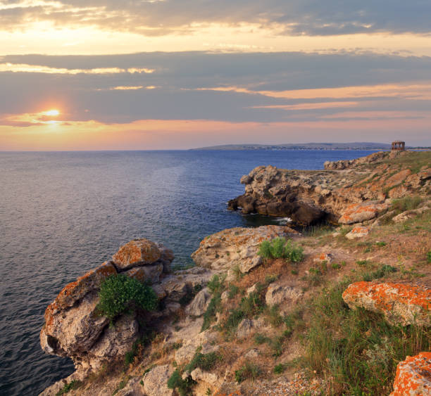 istock Rocky summer coastline and cape with pavilion 1454998181