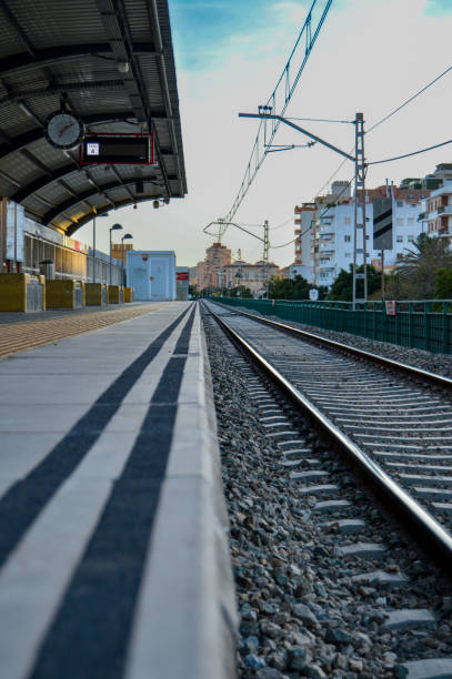 istock Train station with rail and waiting area 1454998658