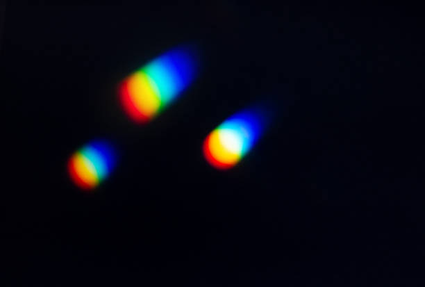 istock Rainbow reflective colorful sunlight on textured surface of wall. Dispersion and refraction of light. 1455008784
