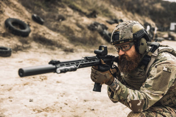 istock Sniper with rifle on a position 1455010735