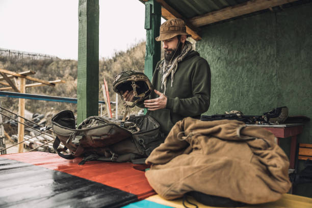 istock New soldier taking military uniform from the bag 1455010769