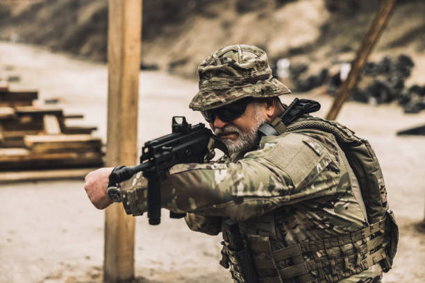 istock Soldier with a rifle on a shooting range 1455010822