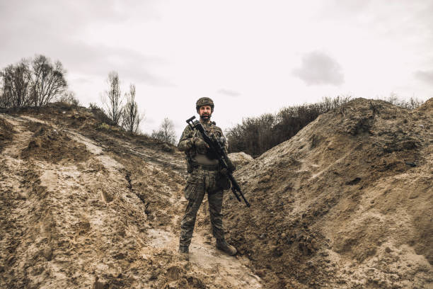 istock Mature man in military uniform and protective hemlet 1455010867