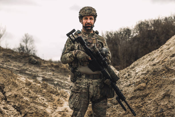 istock Mature man in military uniform and protective hemlet 1455010873