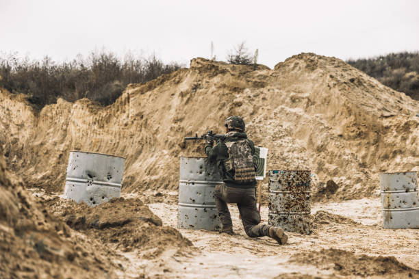 istock Man in military uniform and a rifle 1455010946