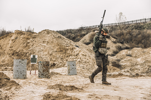 War time. Man in military uniform and a rifle