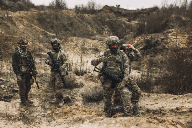 istock Group of soldiers on a shooting range 1455010973