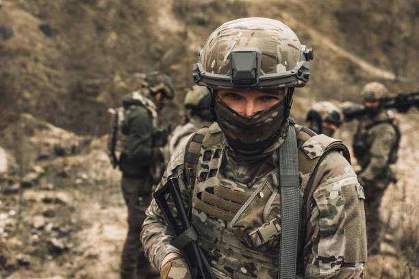 istock Group of soldiers on a shooting range 1455010976