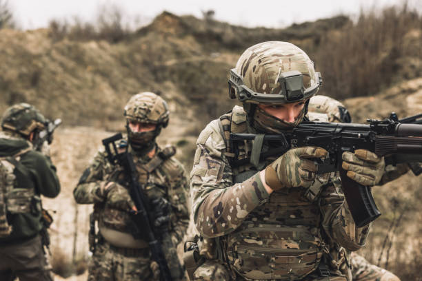 istock Group of soldiers on a shooting range 1455010982