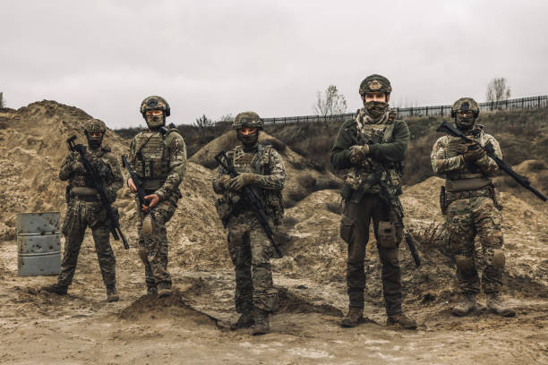istock Soldiers on a shooting range looking concentrated and attentive 1455011014